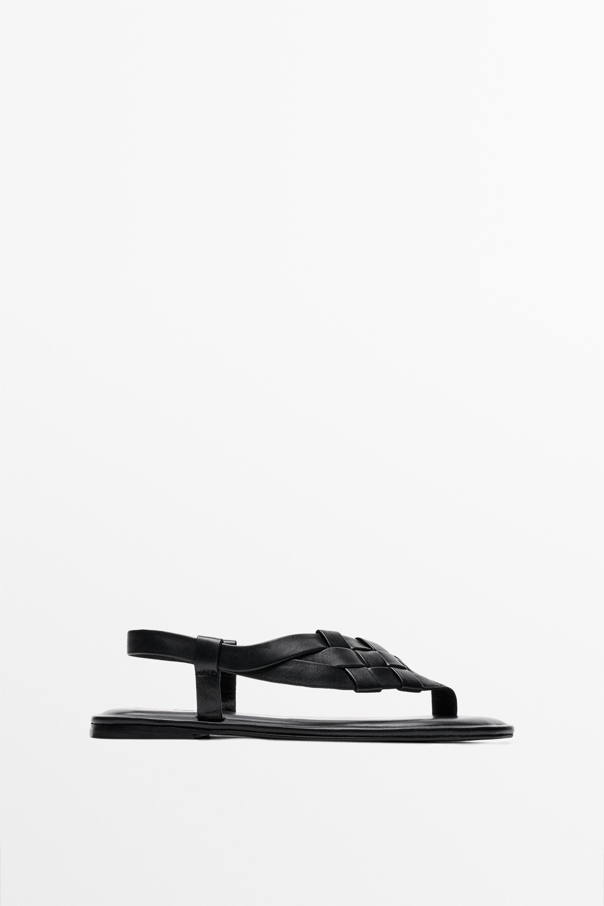 Sandale plate en cuir tressé